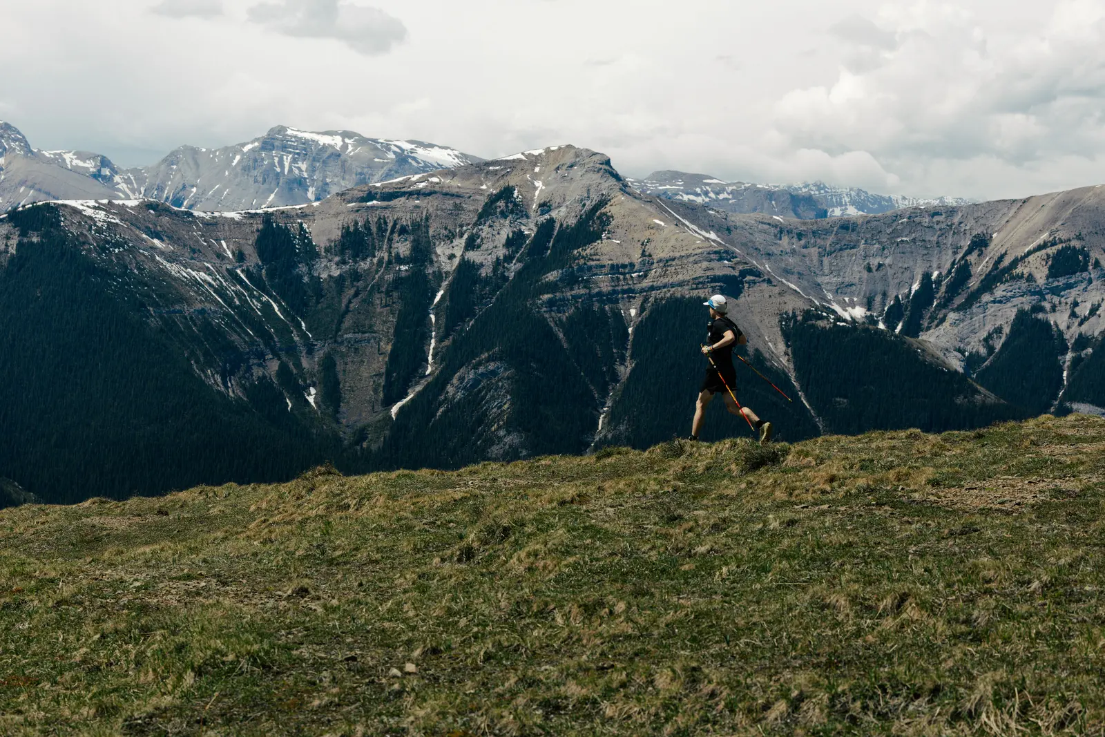 Runners crossing the scree near the summit