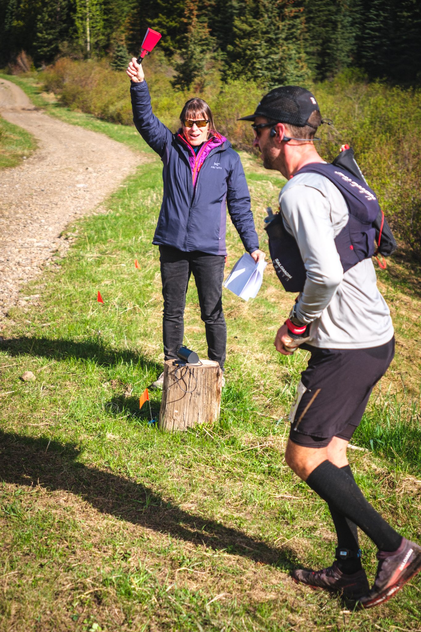 A volunteer cheering a runner through